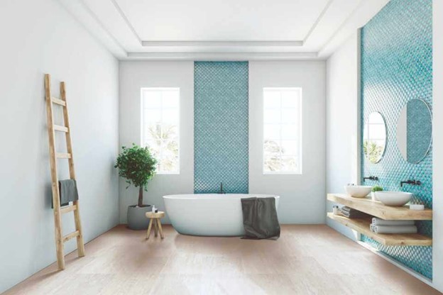 A white wall tile bathroom with a tub and a plant